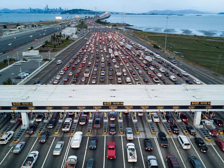 Crowded Toll booth with heavy traffic