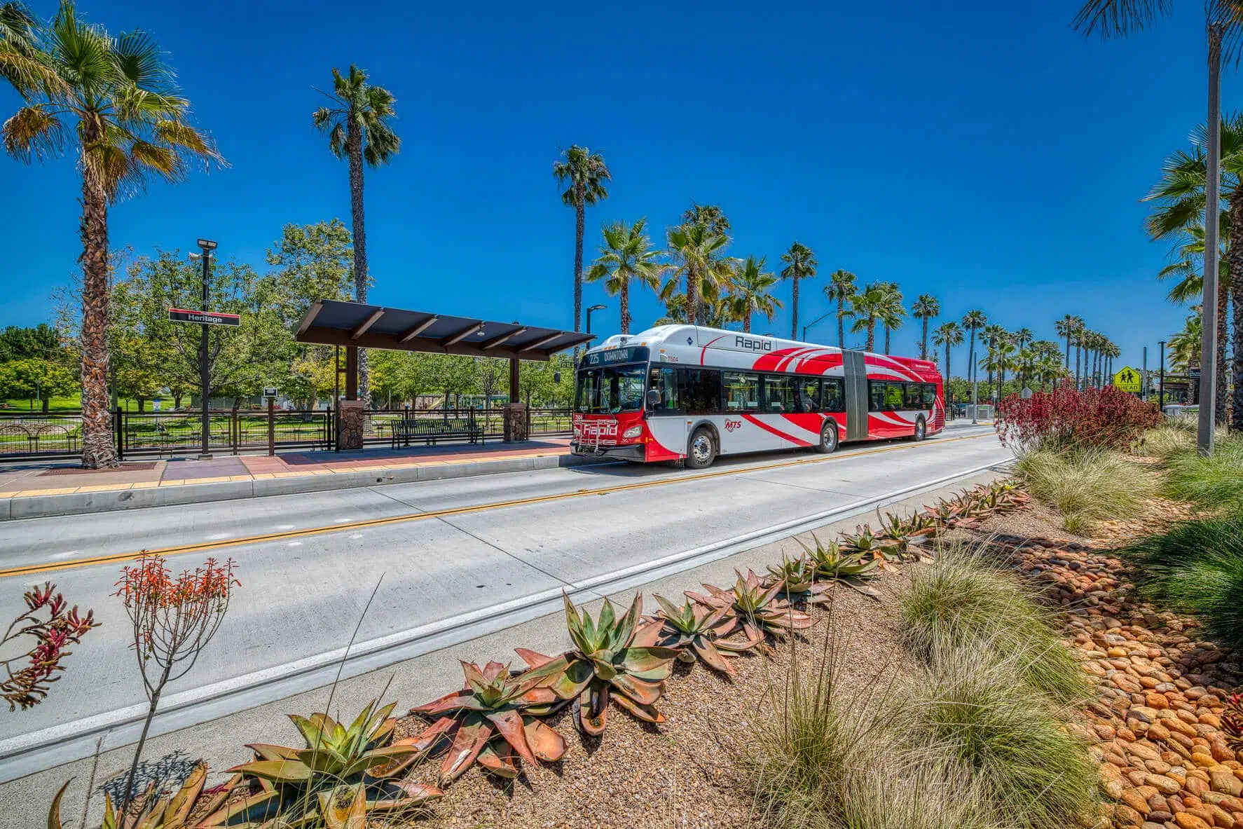 A rapid bus stops at a bus stop.