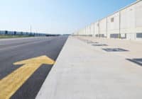 Large arrow guides the way for traffic around the warehouse facility.