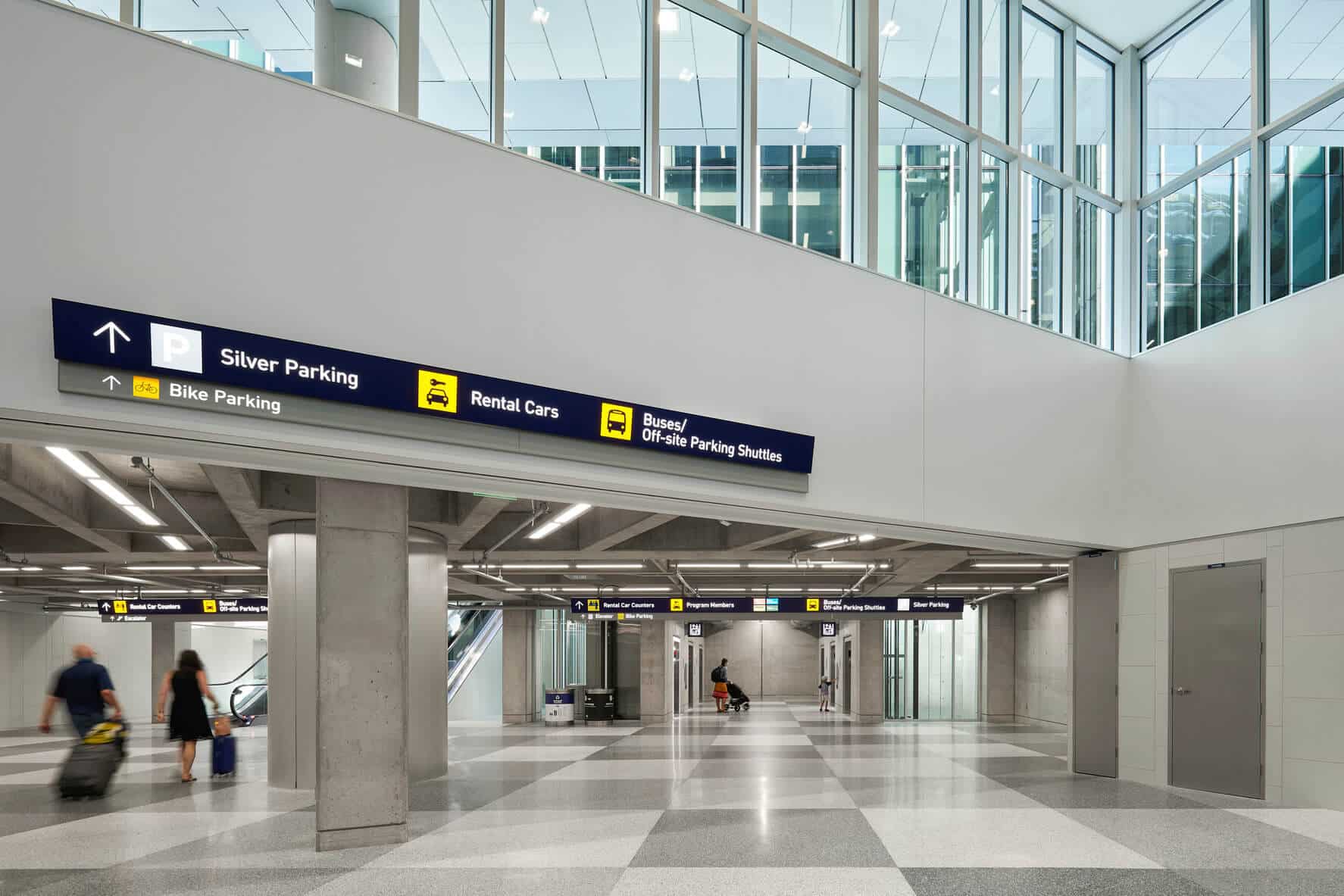 The entrance to the rental car facility with signs showing where to go