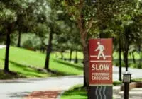 street sign advising people to slow down