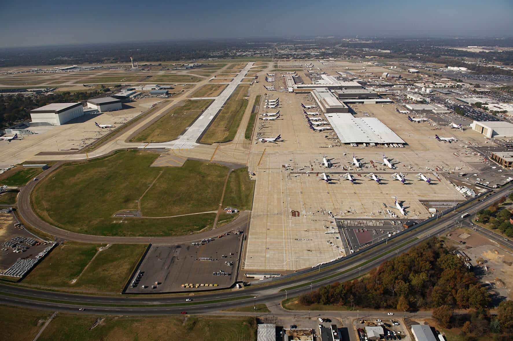 Aerial view of the Memphis Airport with a line of airplanes awaiting takeoff