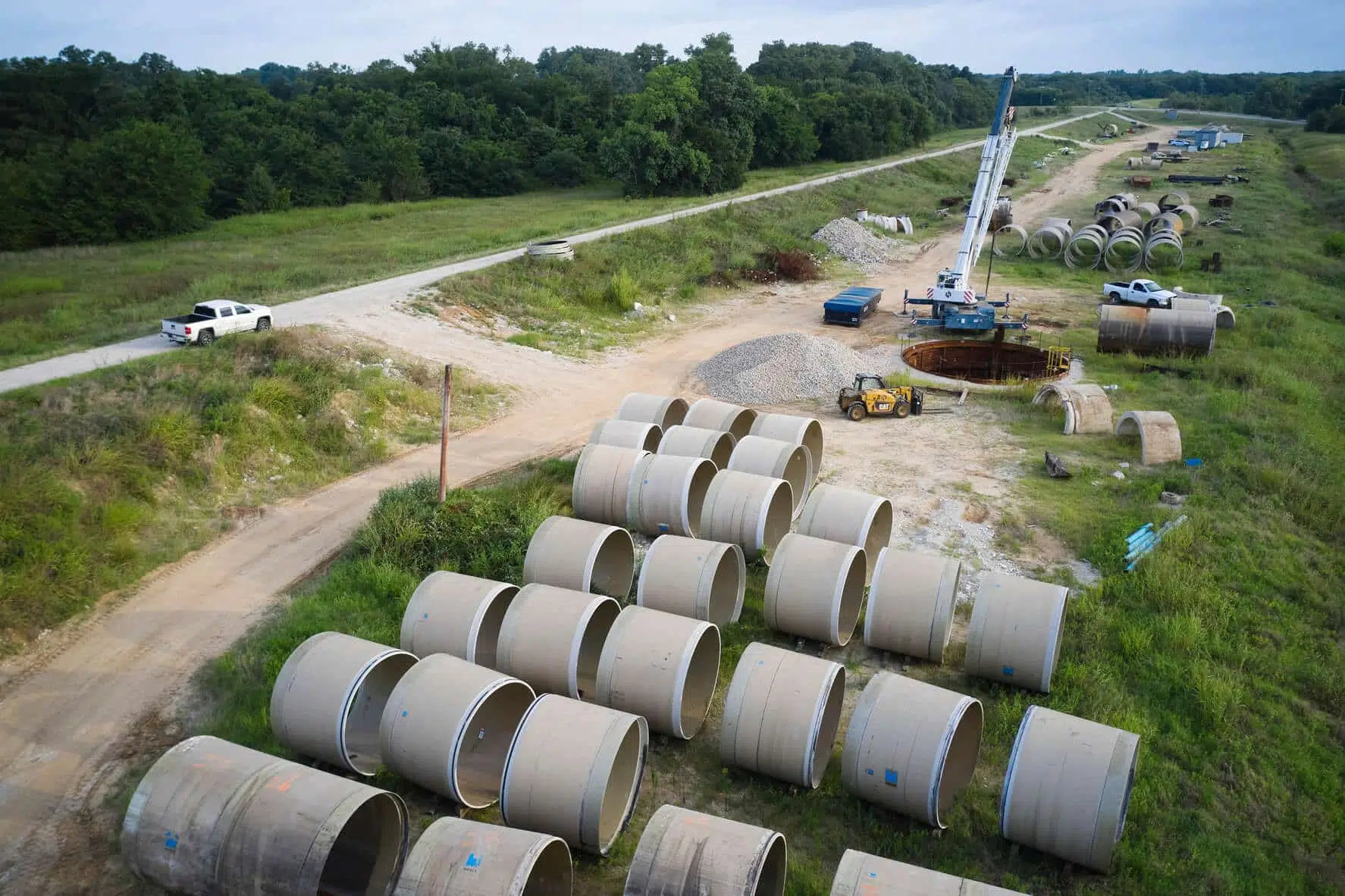 Pipes laid out ready to replace an old pipeline that needs updates and replacements