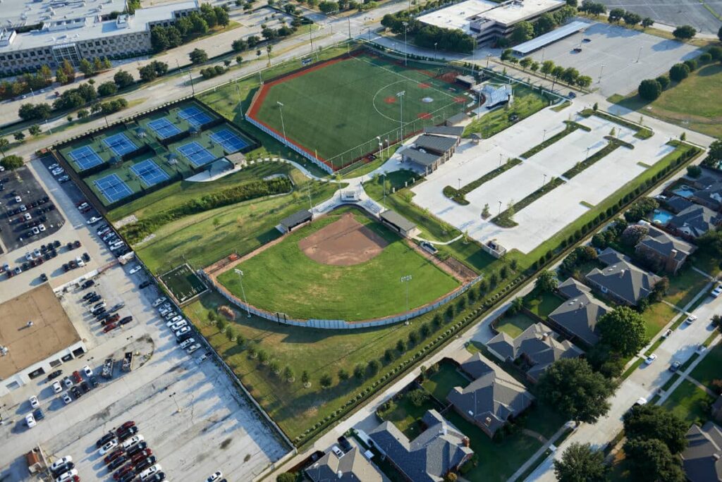 Use fields or parking lots to house portable classrooms to meet social distancing guidelines for the fall semester 2020