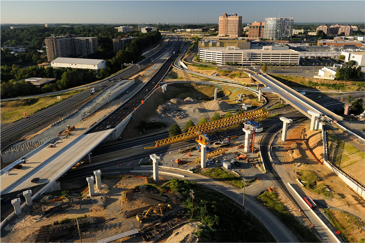 Urban Railway under construction with fewer cars on road