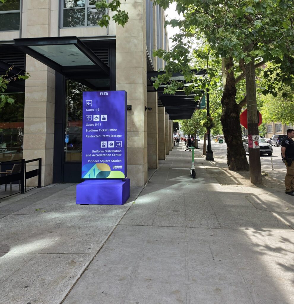 Seattle sidewalk featuring world cup sign